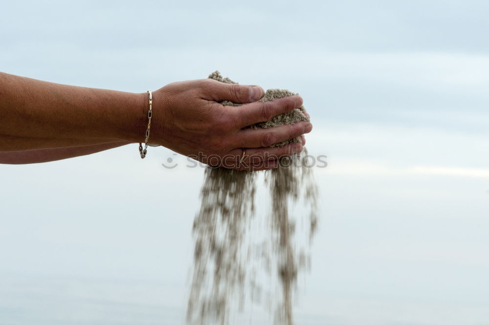 Similar – Gardener distributes seeds by hand