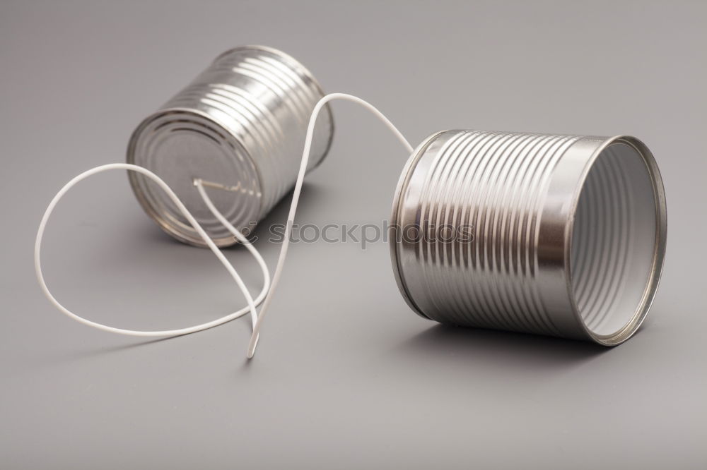 Similar – Roll with thin silver wire in front of yellow background