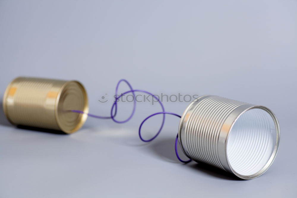 Similar – Roll with thin silver wire in front of yellow background