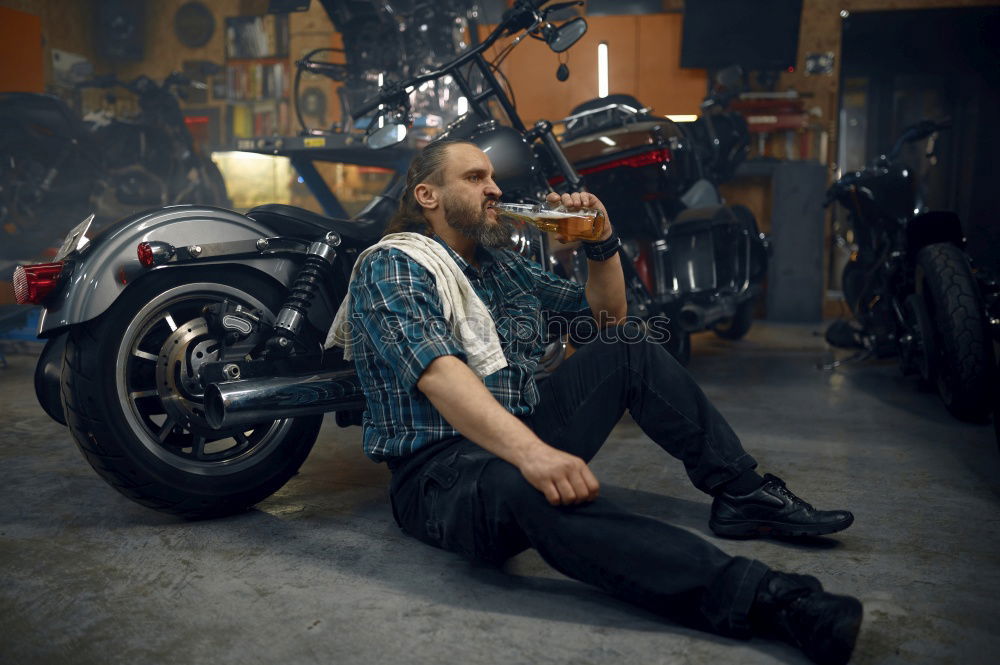 Similar – Image, Stock Photo Biker taking motorbike to the garage