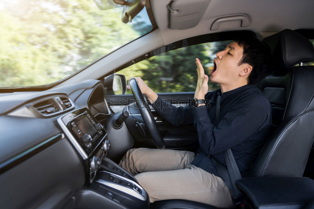 Image, Stock Photo Young man driving a car