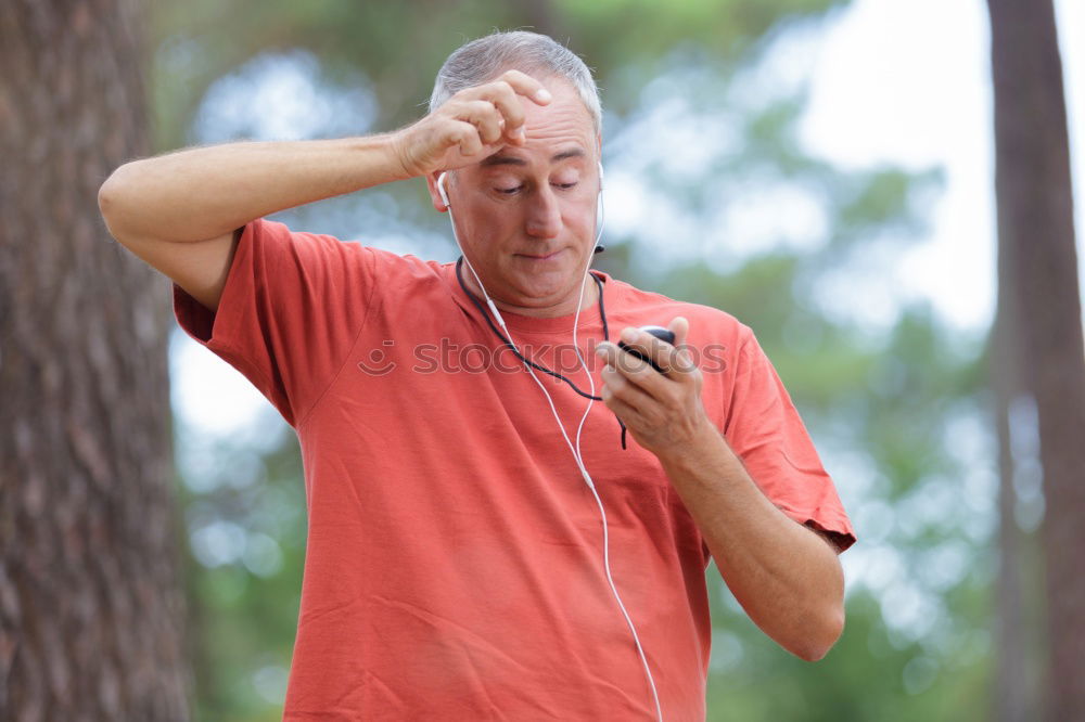 Similar – Senior runner man sitting after jogging in a park