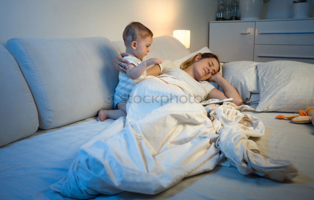 Similar – Brother and sister tickling and laughing on bed