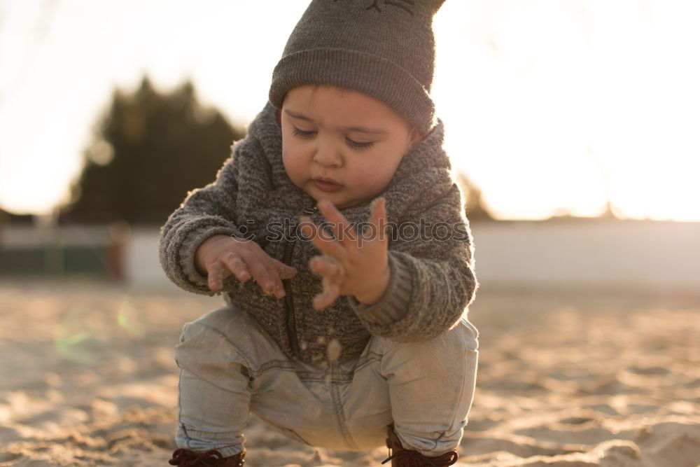 small baby climbing a ladder