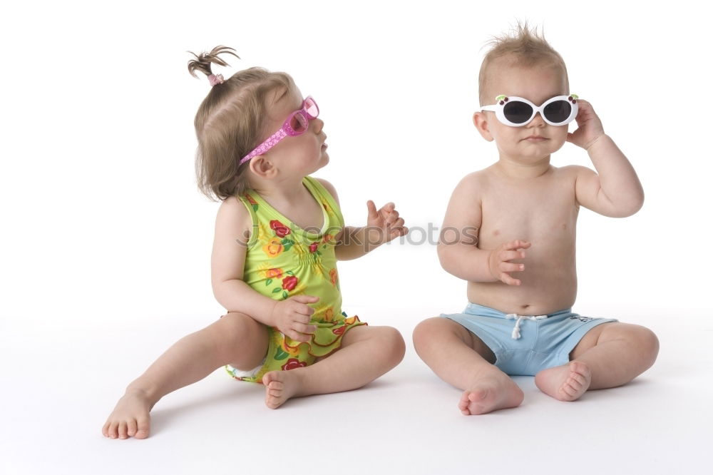 Image, Stock Photo Two happy children lie on a hammock and play with soap bubbles.