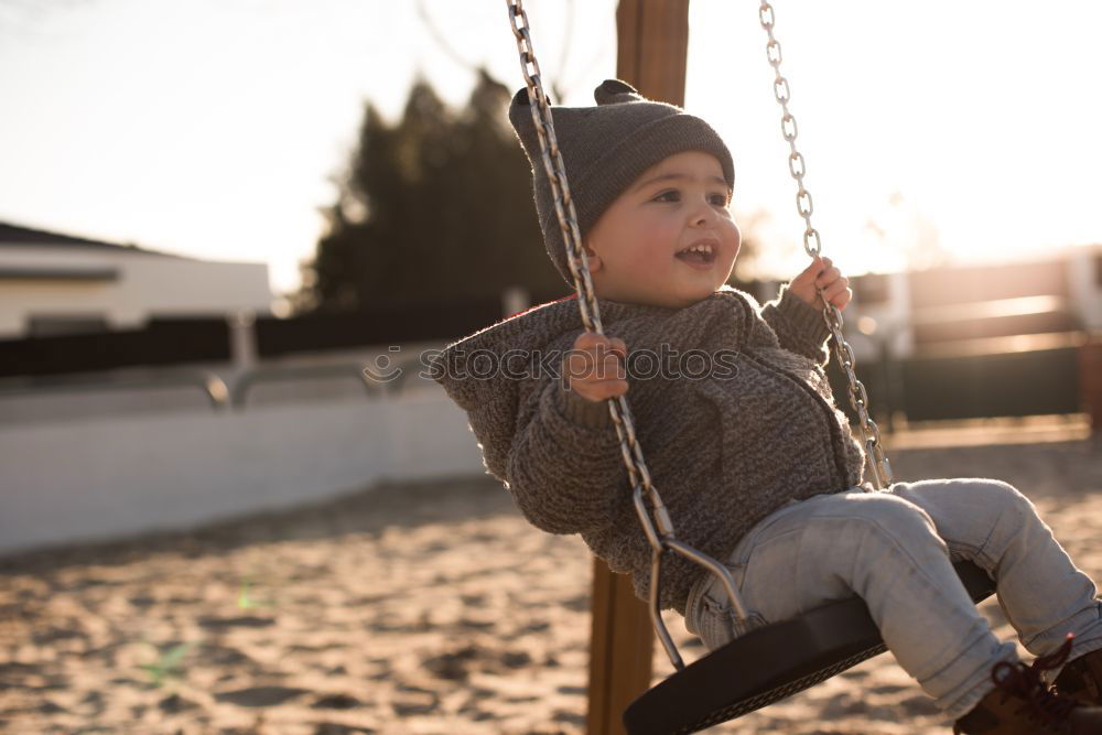 Similar – Little caucasian girl having fun on slide on playground