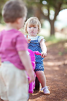 Similar – Image, Stock Photo Young boy pushing little sister in a baby stroller