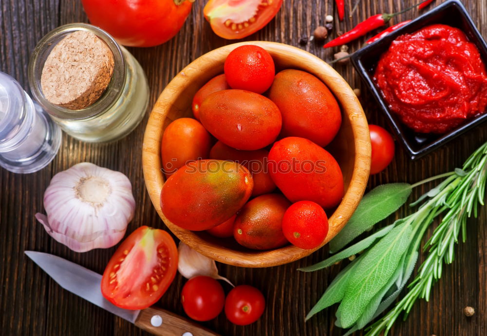 Similar – Fresh red tomatoes with herbs