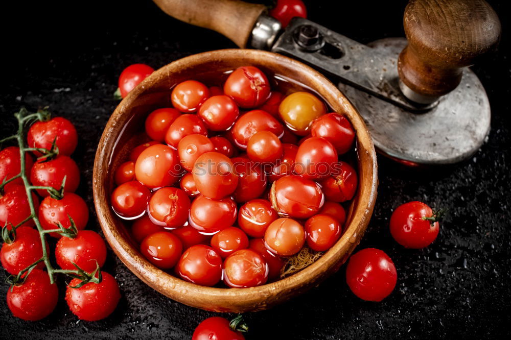 Similar – Image, Stock Photo cast iron round frying pan and ripe red cherry tomatoes