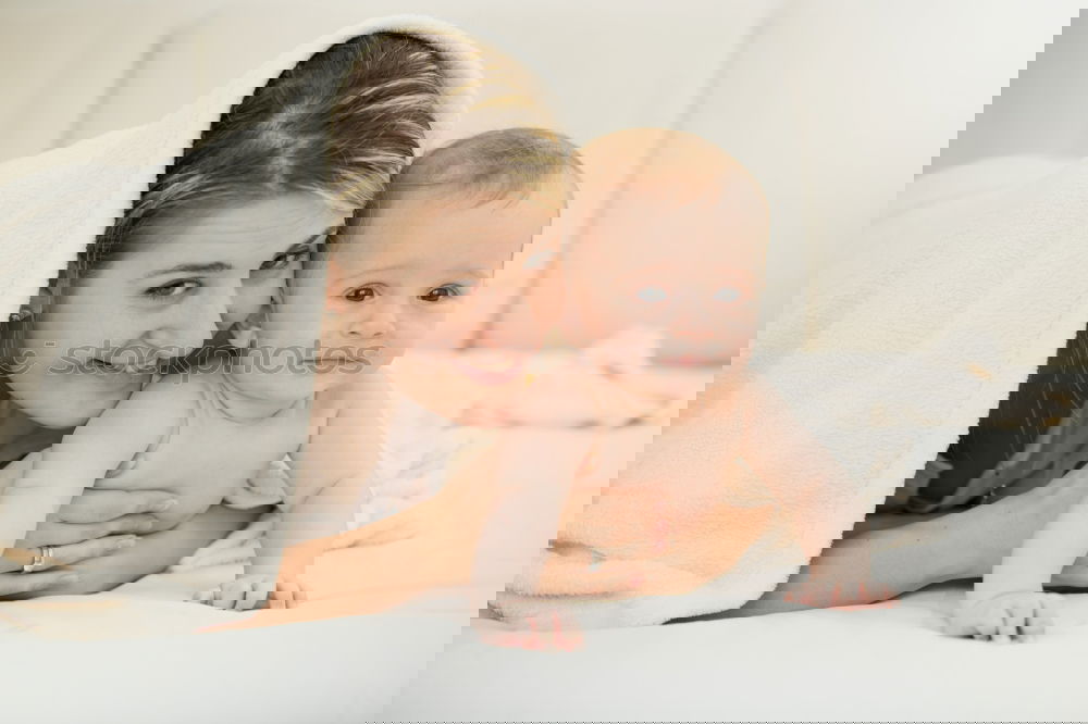 Similar – Image, Stock Photo Newborn lying over bed and couple smiling on background