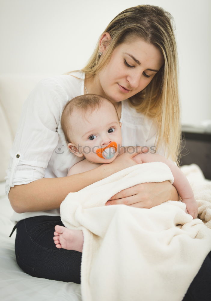 Similar – Image, Stock Photo Young Mother holding newborn baby