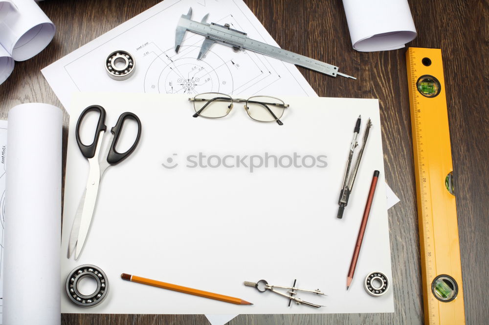 Similar – Red and black desk utensils on a wooden table. notebook, pencils, ruler, tape, sharpener, paper clips, book, stapler