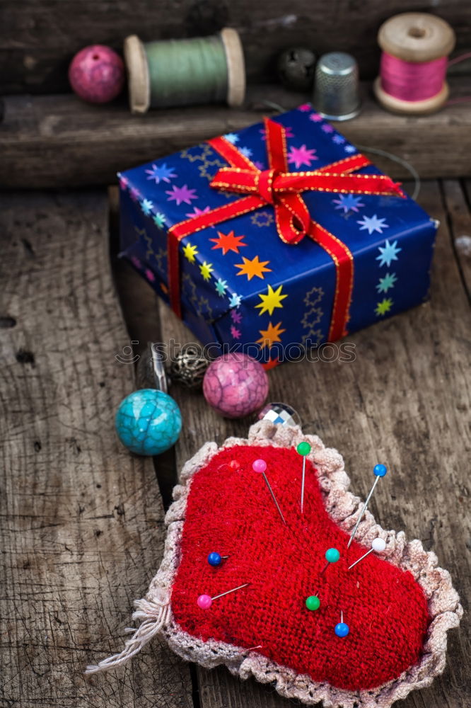 Similar – Image, Stock Photo colourful christmas parcels packed with christmas paper with red bow, on rustic wood. Christmas presents, lie nicely decorated with ribbon on wooden table. Many Christmas parcels wrapped with wrapping paper with Christmas motif. Concept gifts Advent.