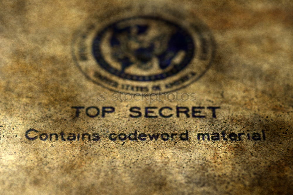 Similar – The letters TOP SECRET with an envelope on a rustic wooden table