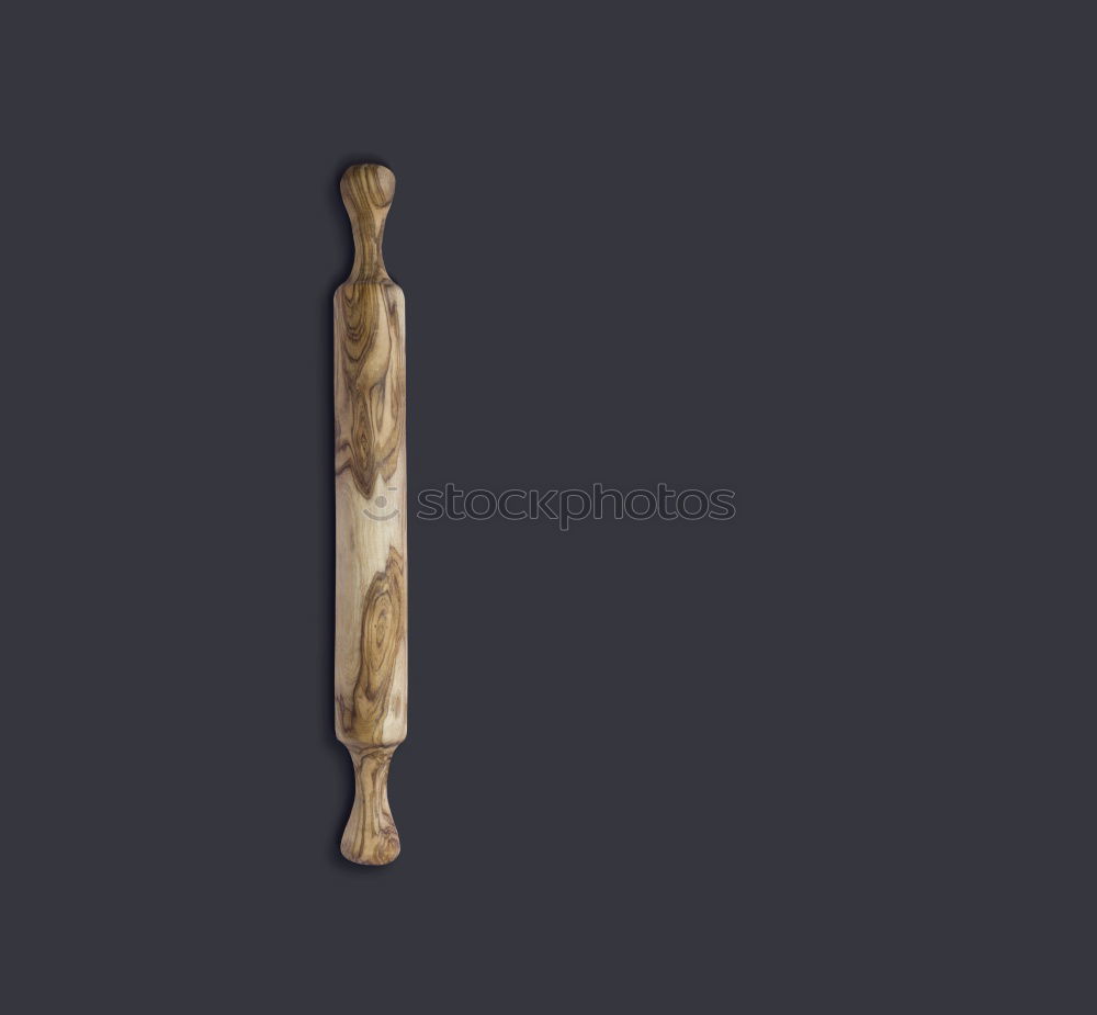 Similar – rolling pin on black wood as background