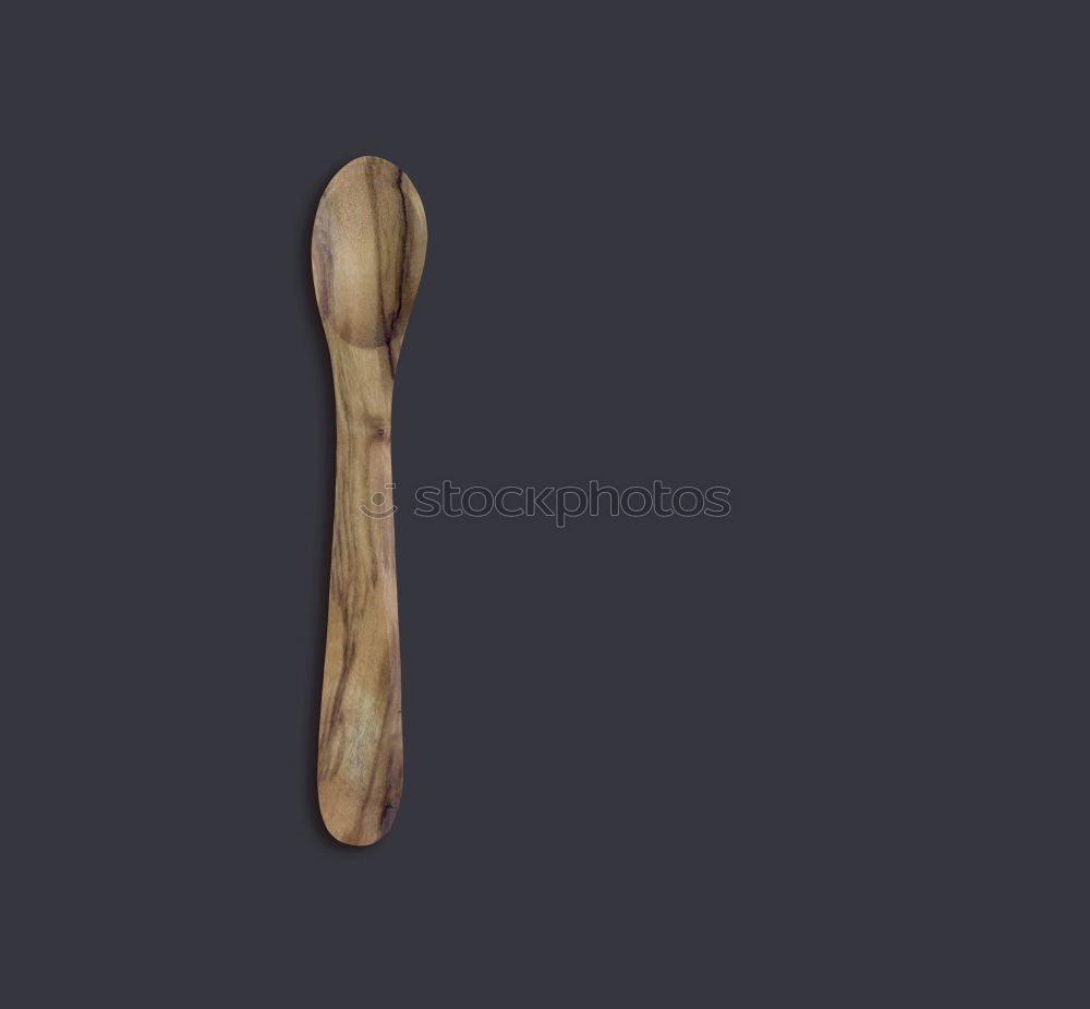 rolling pin on black wood as background