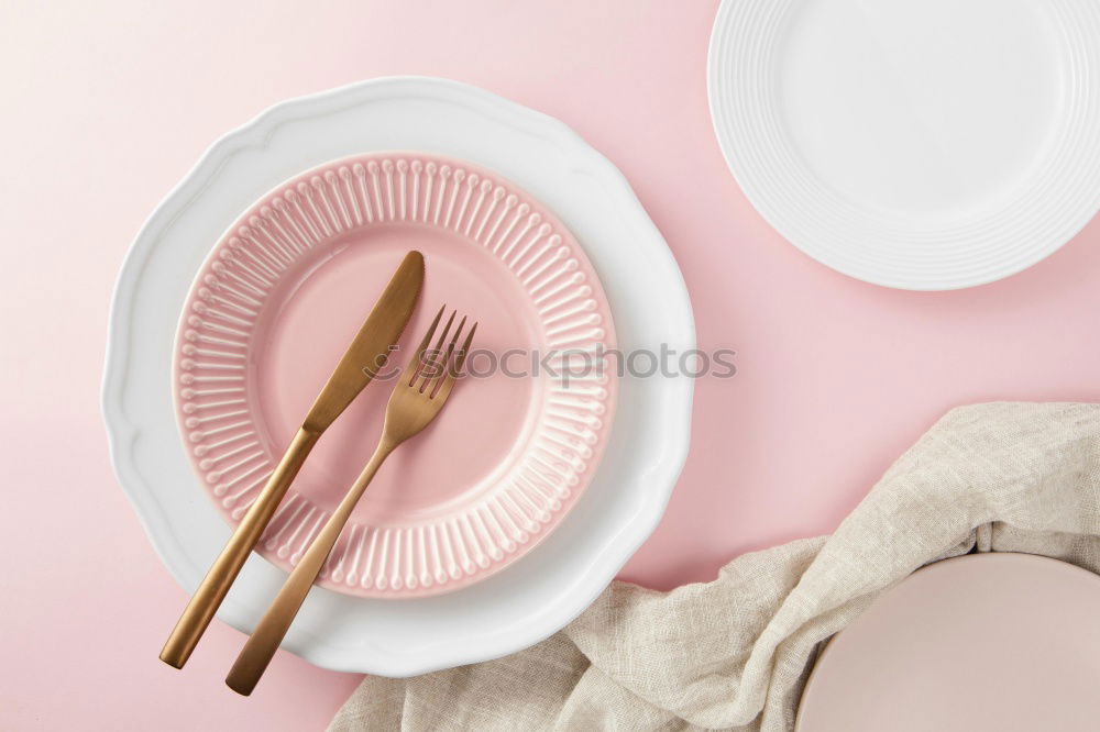 Similar – Disposable colorful plastic dish, straws and cups, cutlery. Flat lay on pink background.