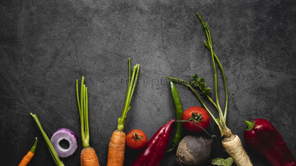 Fresh vegetables and a glass of carrot juice