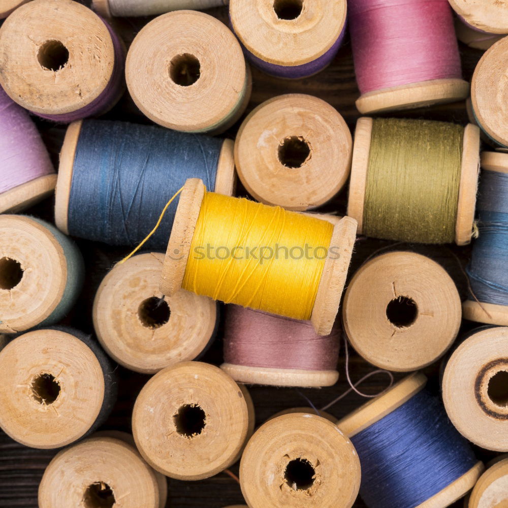 Similar – Image, Stock Photo Five old sewing thread thread rolls in pastel colours on wood