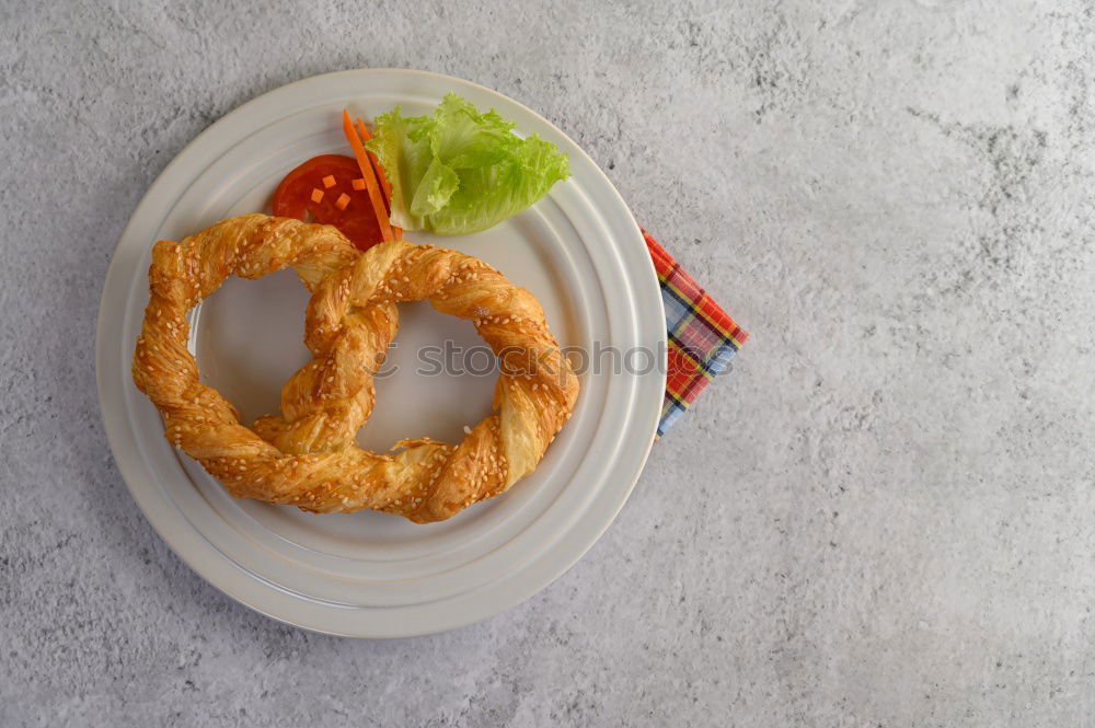 Image, Stock Photo Pretzel with knife and fork on white background. Pretzel