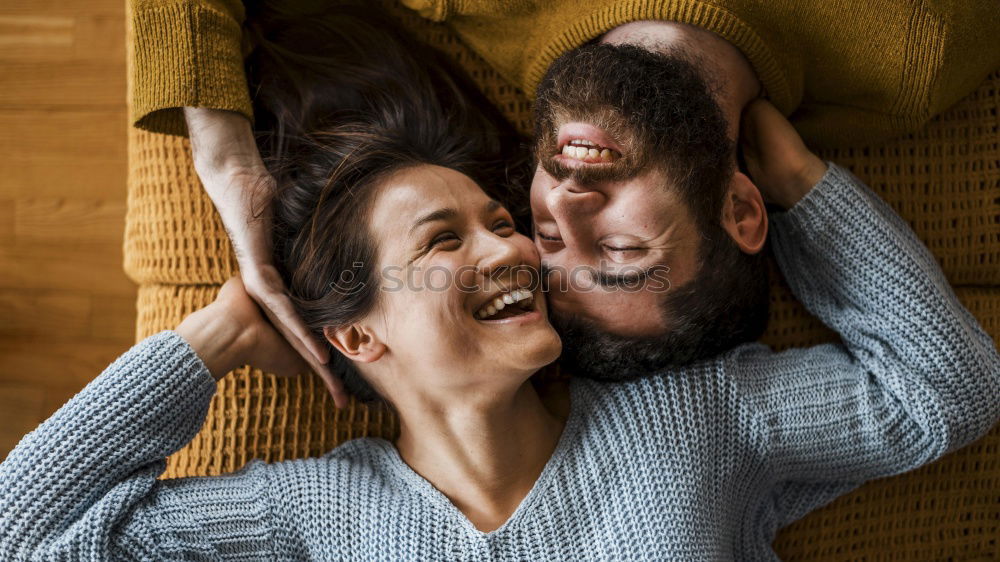 Similar – Couple with fluorescent paint kissing