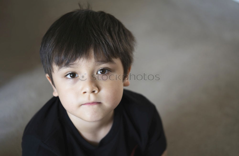 Similar – cute sad child boy portrait