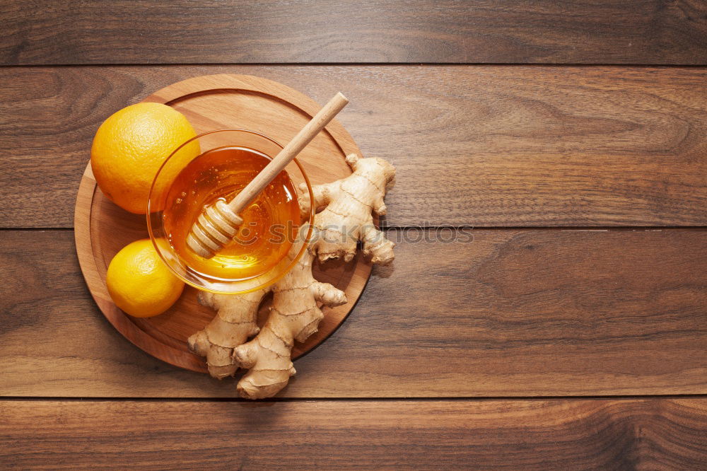 Similar – Image, Stock Photo Tea- Time: a tea cup with tea bag, sugar and cookies on a wooden table