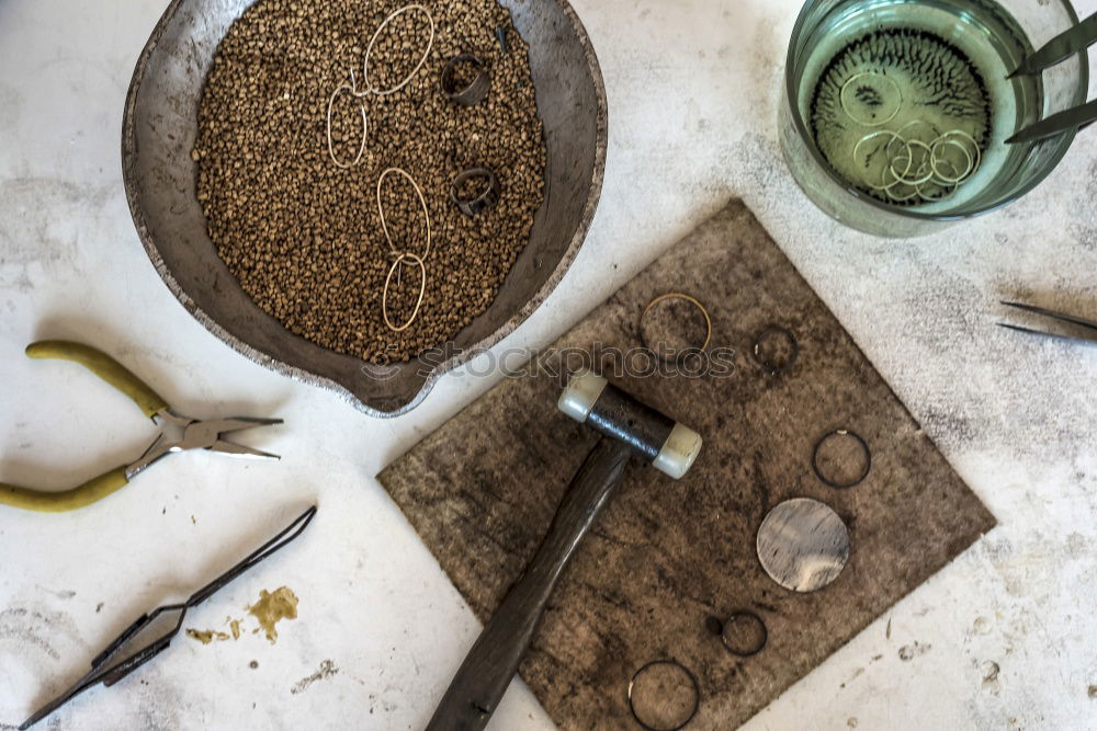 Similar – Green office: notepad with pencil, eraser, sharpener, hole punch and a cup of coffee