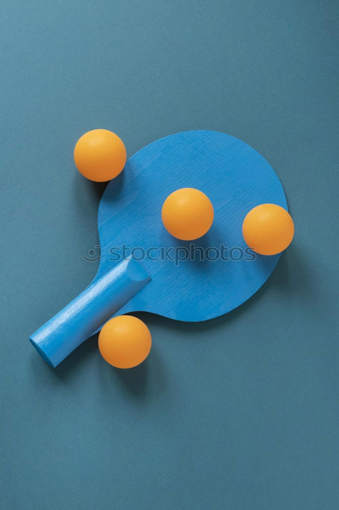 Image, Stock Photo To the point! A plate with a blue rim, on it many green and a blue ball, dots and a fork on a wooden table