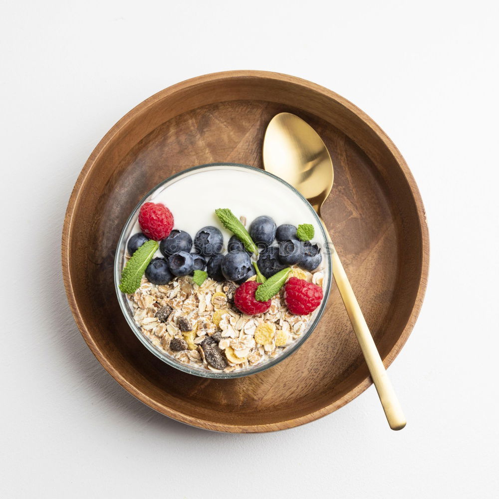 Similar – Image, Stock Photo Smoothie mango bowl with chia seeds yogurt pudding and cranberries, nuts, oatmeal topping in coconut shells with spoon. Healthy clean breakfast food. Copy space for your text or design