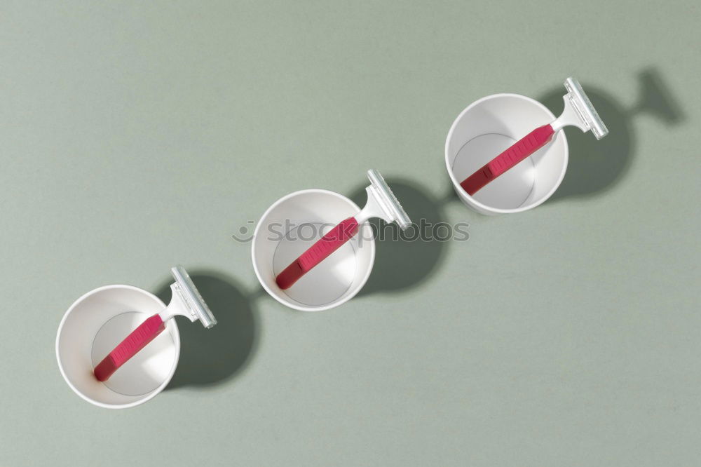 Similar – Image, Stock Photo A set of dentures lies ready on the bedside table together with a 60s alarm clock. Vintage. Seniors, dentures