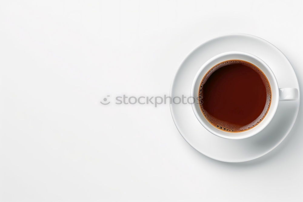 Similar – Image, Stock Photo Overhead view of a cup of black espresso coffee and a freshly baked croissant for breakfast. High angle close up