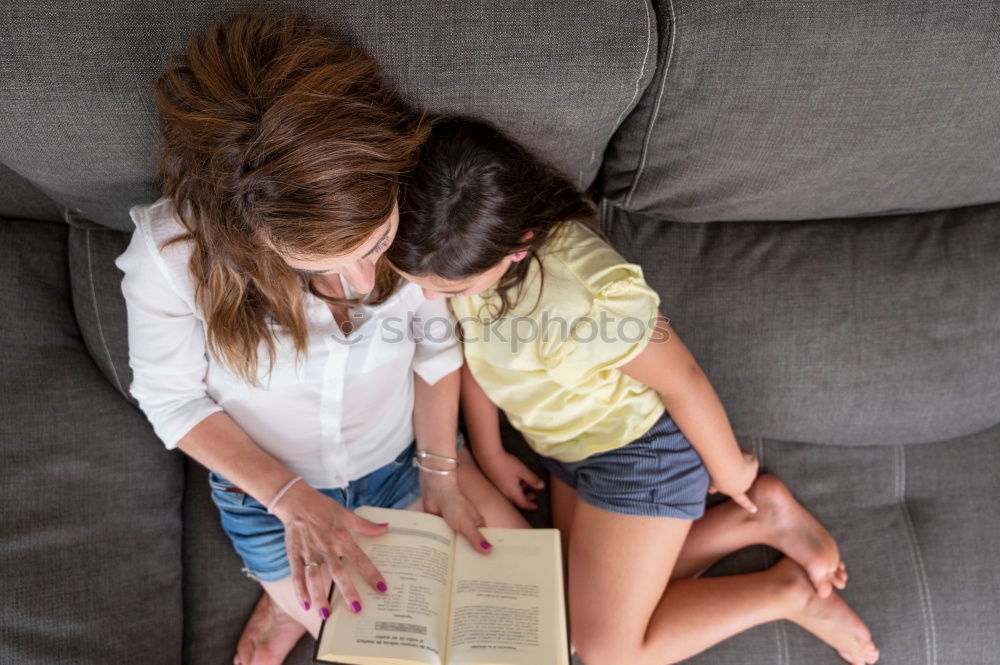 Similar – Mother and her child with digital tablet.