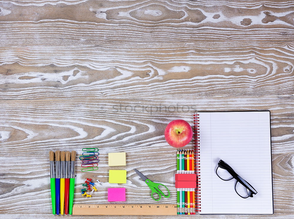 Similar – workplace with notepad, glasses, watch, pen