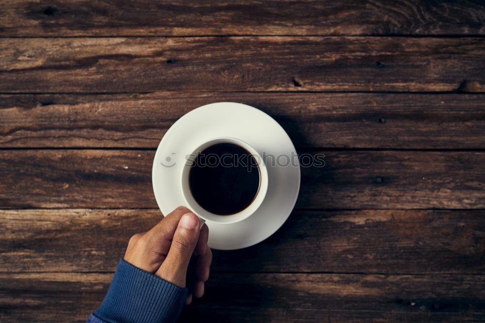 Similar – Hands with coffee cups on table in a urban cafe.