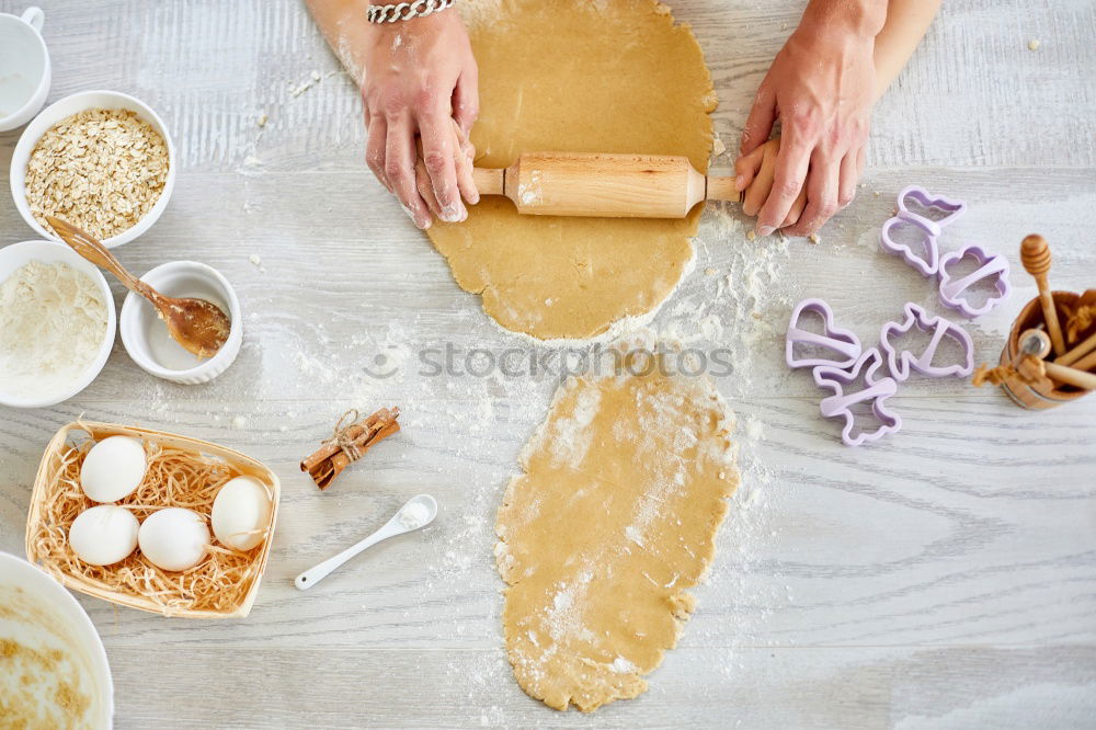 Similar – woman in bakery preparing sweets adding egg