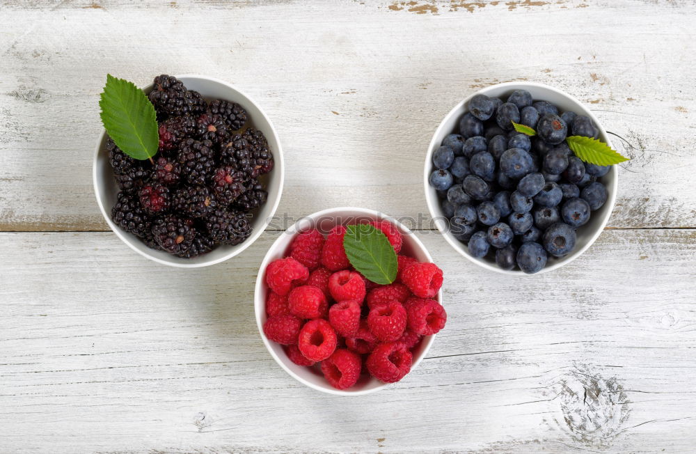 Similar – Image, Stock Photo Red and black raspberry and blueberry