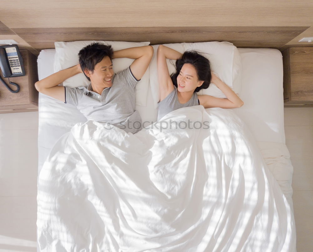 Similar – happy kid girl waking up in early morning in her room, lying in bed