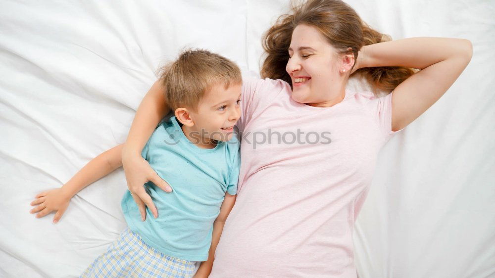 Similar – Two beautiful sisters playing on bed