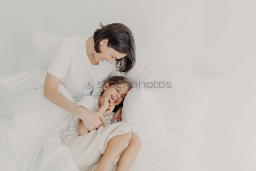 Image, Stock Photo happy mother hugs her toddler son in the morning
