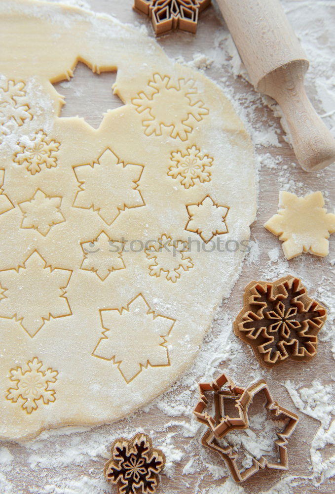 Similar – Cooking Christmas cookies with cookie cutters on a dark table