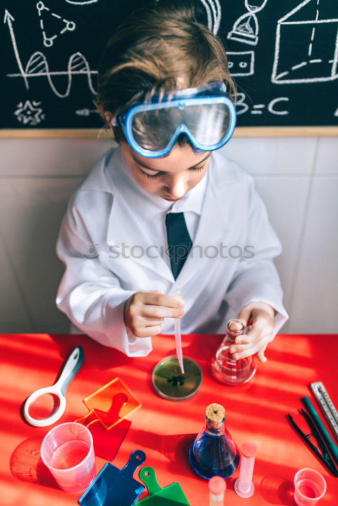 Similar – Image, Stock Photo Boy playing with chemistry game