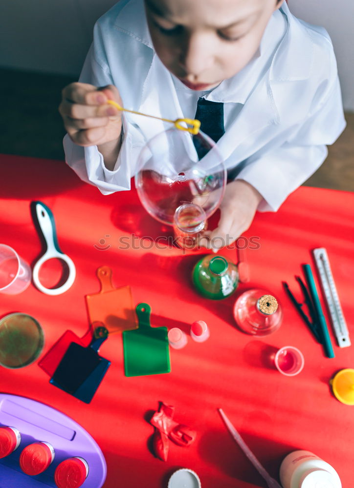 Similar – Image, Stock Photo Boy playing with chemistry game