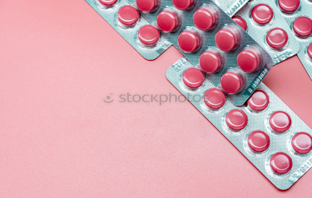 Similar – Pink tablets pill on blur blister pack of tablets pills on pink background. Prescription drugs. Woman health concept. Pharmaceutical industry. Online pharmacy banner. Drugs packaging. Treatment dose.