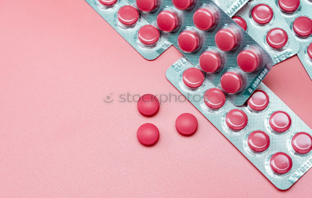 Similar – Pink tablets pill on blur blister pack of tablets pills on pink background. Prescription drugs. Woman health concept. Pharmaceutical industry. Online pharmacy banner. Drugs packaging. Treatment dose.