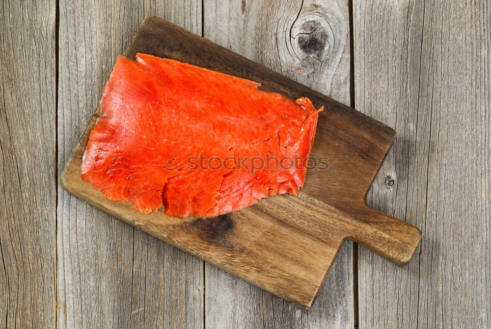 Similar – Fresh raw salmon on a wooden cutting board