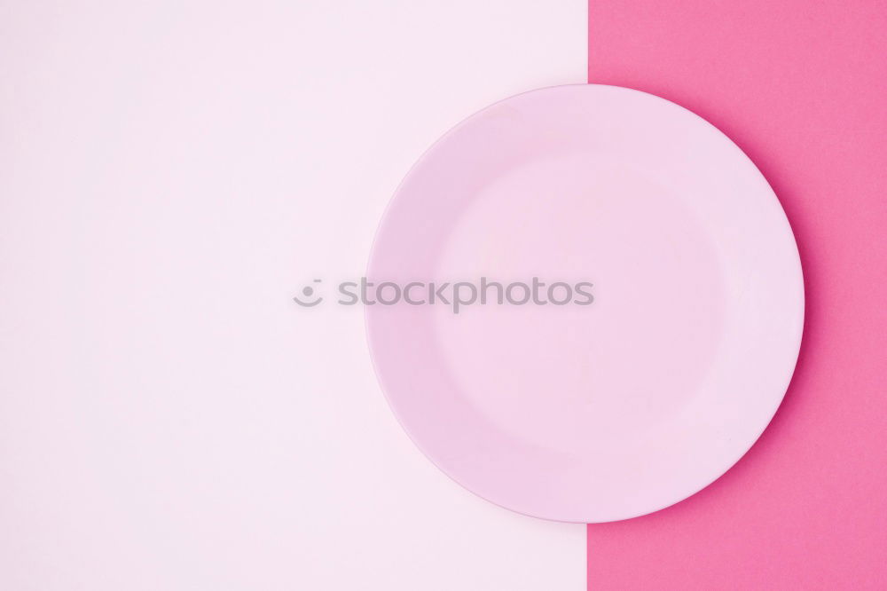 Similar – Disposable colorful plastic dish, straws and cups, cutlery. Flat lay on pink background.