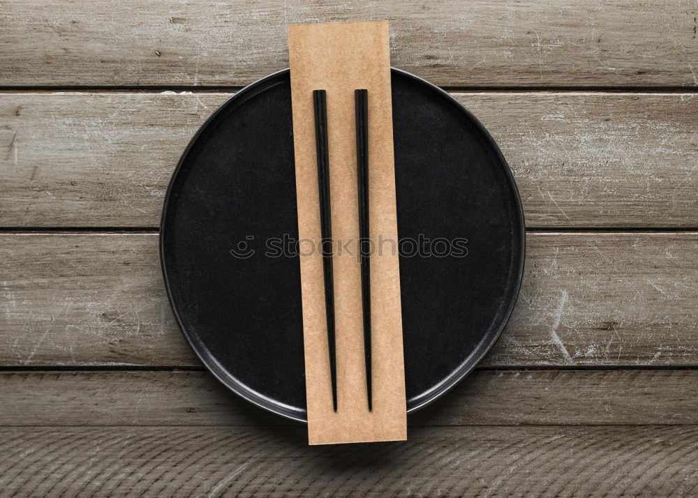 menu place setting with empty card and golden spoon over