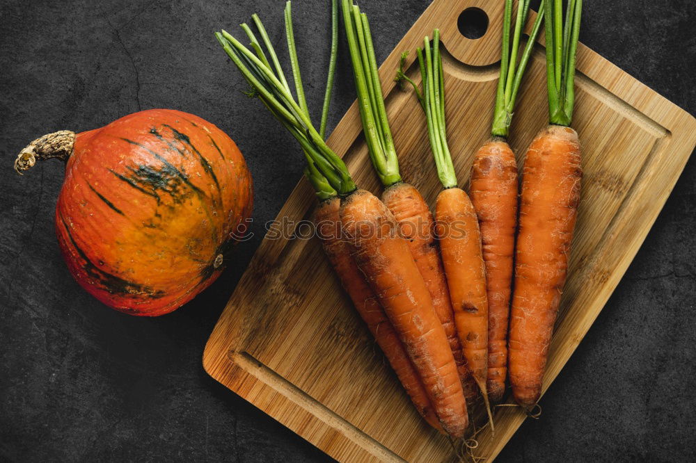 Similar – Carrot fresh juice in a glass container among the vegetables