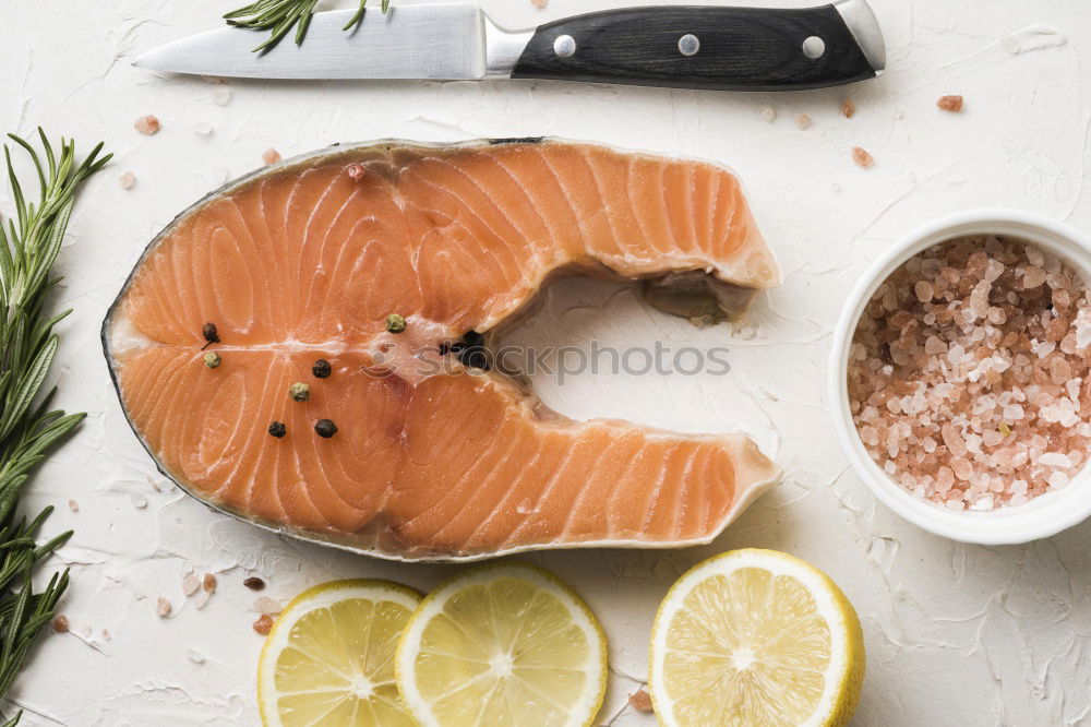 Similar – Salmon with spinach on a white kitchen table